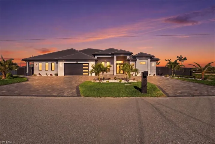 Contemporary single-story residence with a gray exterior finish and dark tile roof