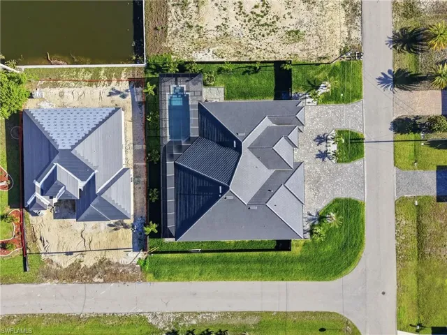 Modern residence featuring a multi-gabled roofline and an integrated swimming pool