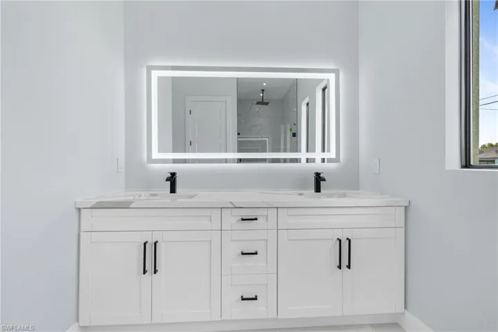 Bathroom with dual bowl vanity