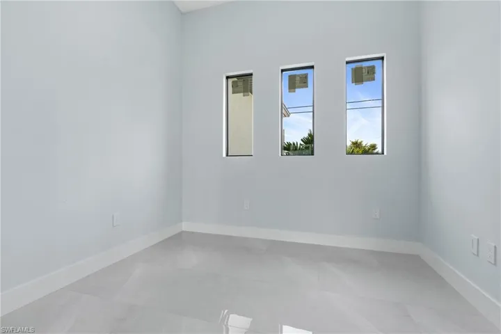 Empty room featuring tile patterned floors