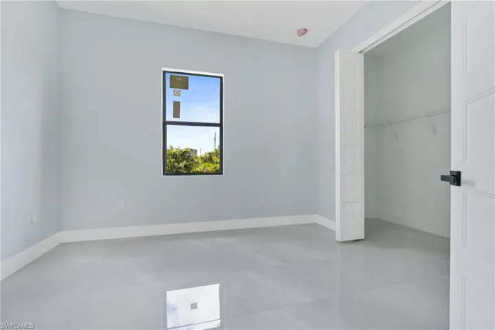 Unfurnished bedroom featuring tile patterned flooring