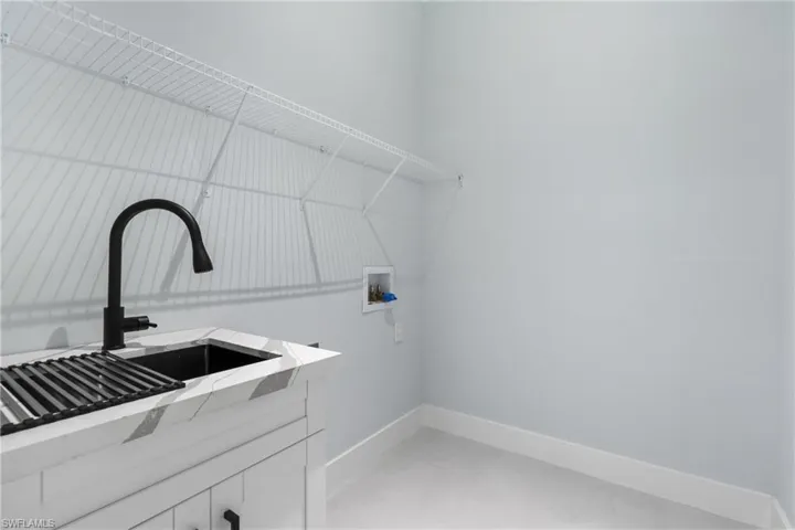 Washroom featuring sink and hookup for a washing machine