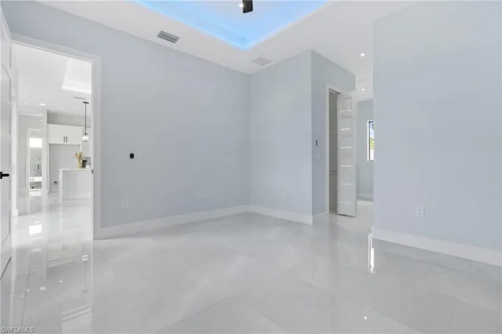 Empty room featuring light tile patterned floors