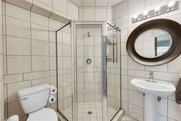 Pool bath features a walk-in shower.