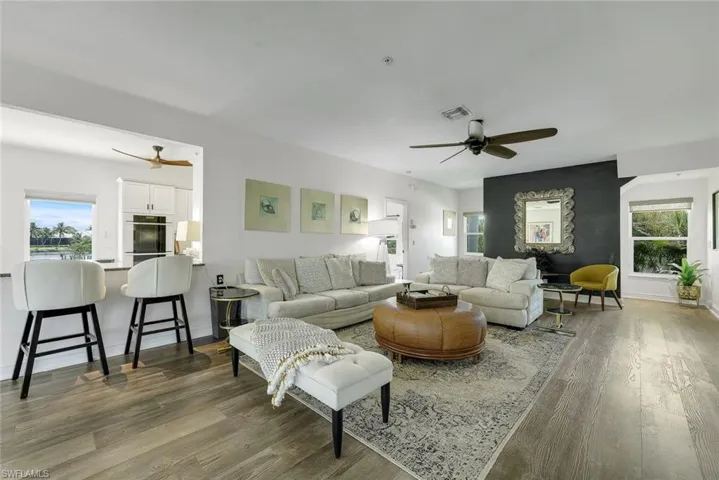 Open living area with easy access to the kitchen, outdoor lanais, and the pool.