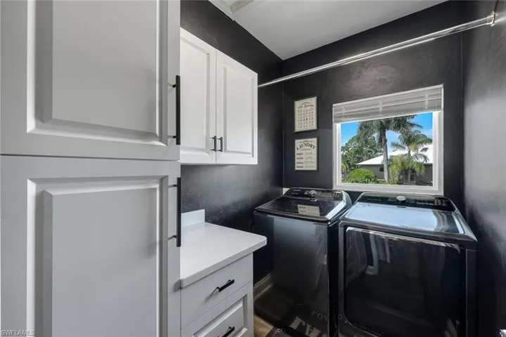 Large laundry room offers plenty of storage.