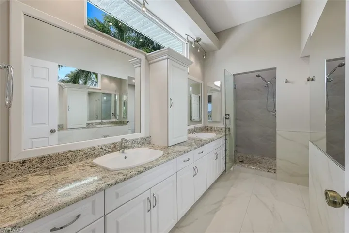 Spa-like ensuite with separate sink areas, a gorgeous shower, plenty of cabinet space and a TON of natural light!