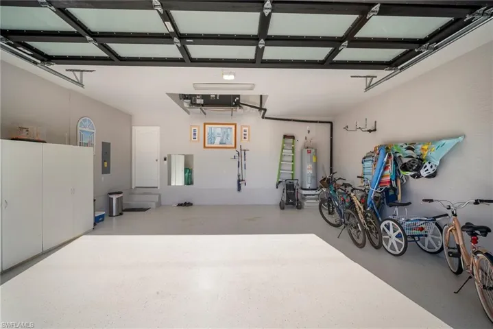 Garage with water heater and electric panel
