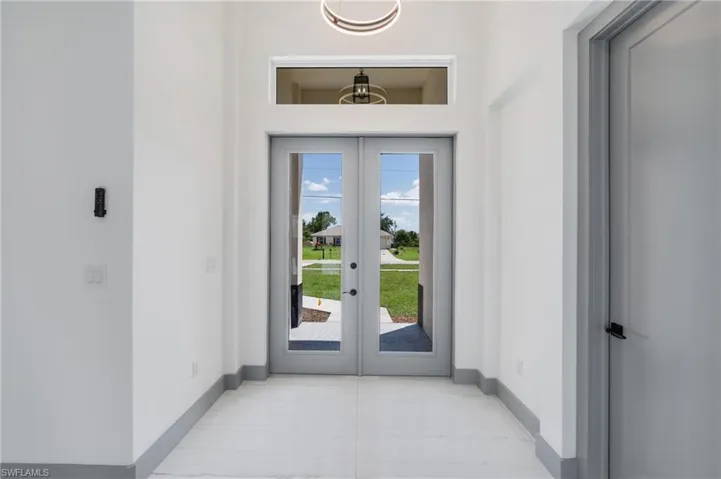 Doorway to outside featuring a wealth of natural light and french doors