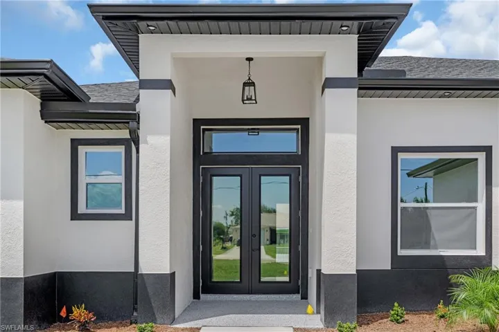 Doorway to property featuring french doors