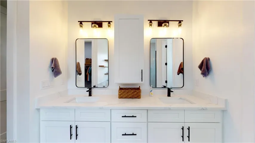 Bathroom featuring double vanity