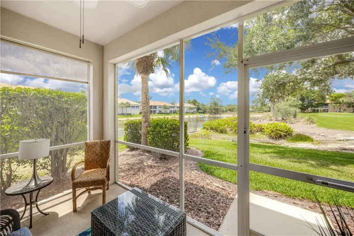 Sunroom featuring a water view and plenty of natural light