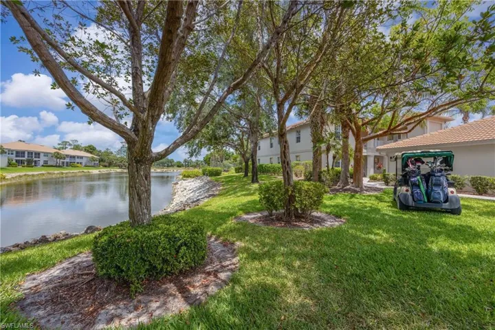 View of green lawn with a water view