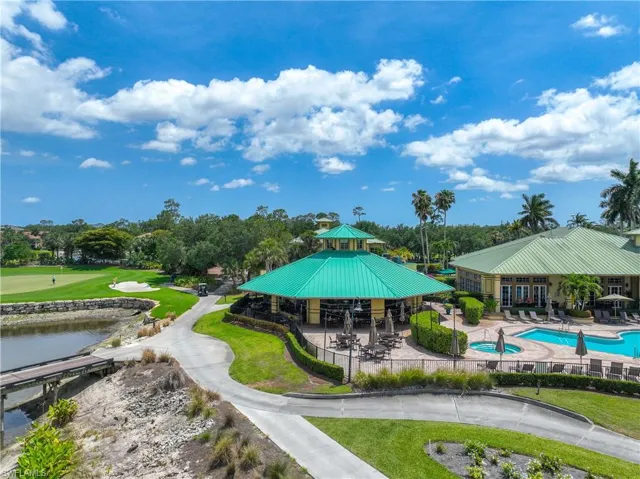 View of home's community featuring a gazebo, a pool, fence, a patio, and view of scattered trees