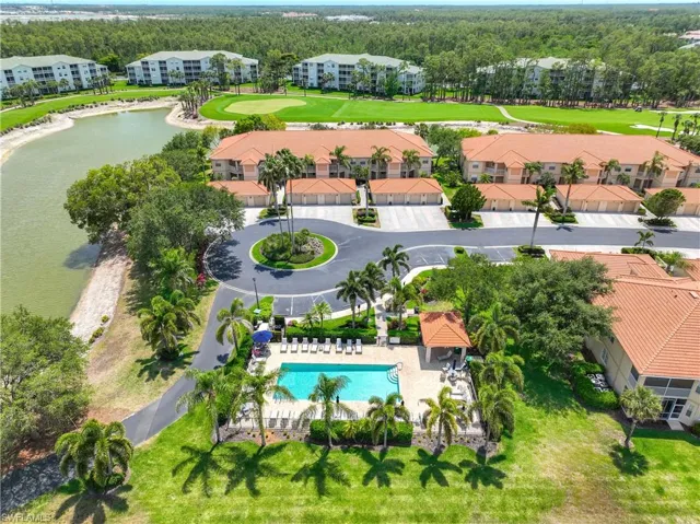 Bird's eye view of a pool area and a nearby body of water