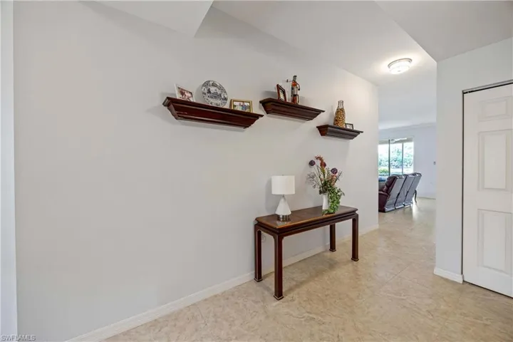 Corridor featuring baseboards