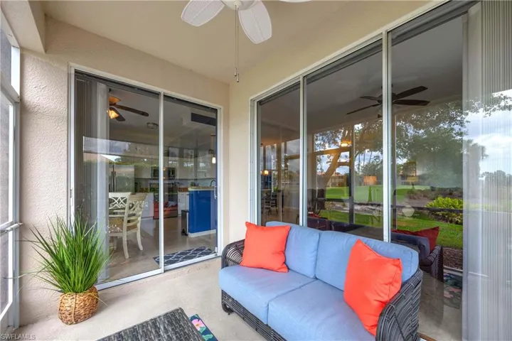 Sunroom / solarium featuring ceiling fan