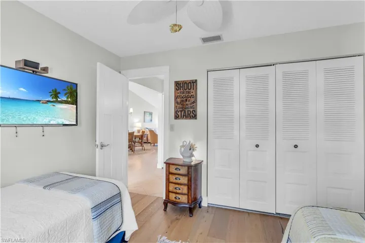 Guest bedroom view 2, with custom closets