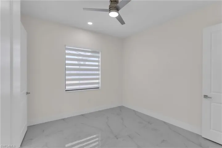 Unfurnished room featuring ceiling fan