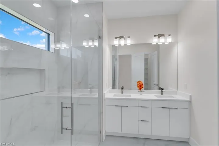 Bathroom featuring vanity and walk in shower