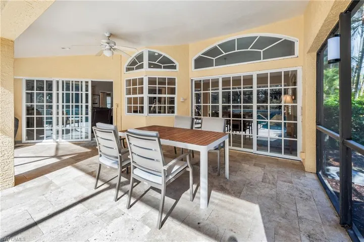 Sunroom featuring ceiling fan
