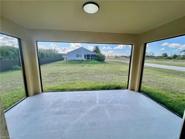 Screened lanai overlooking the backyard with panoramic screening.