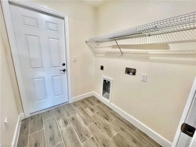 Laundry area with washer hookup and hookup for an electric dryer