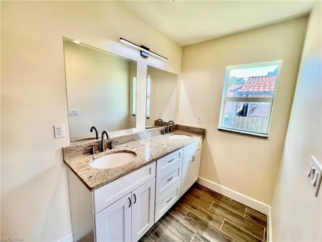 Dual sinks with GRANITE tops.