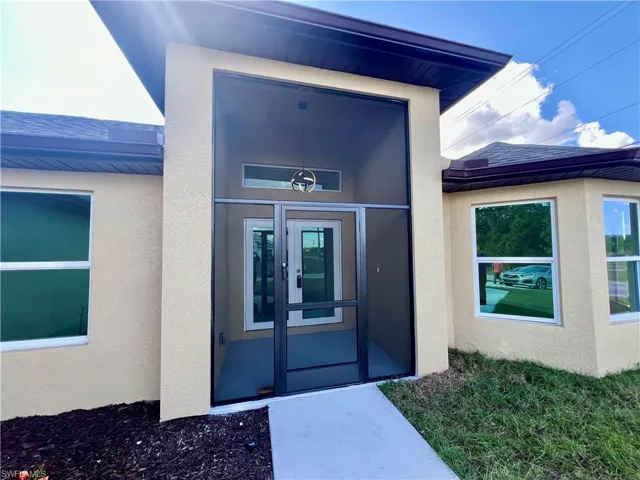 Screened front entry porch.