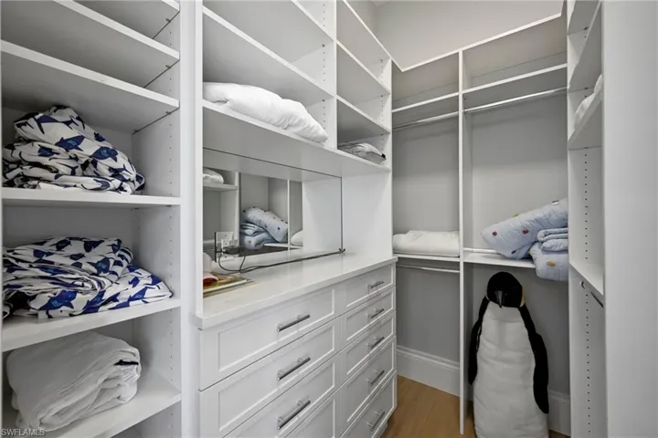 Walk in closet featuring light wood-type flooring