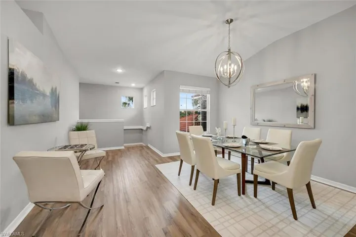 Dining room with a chandelier and light wood-type flooring