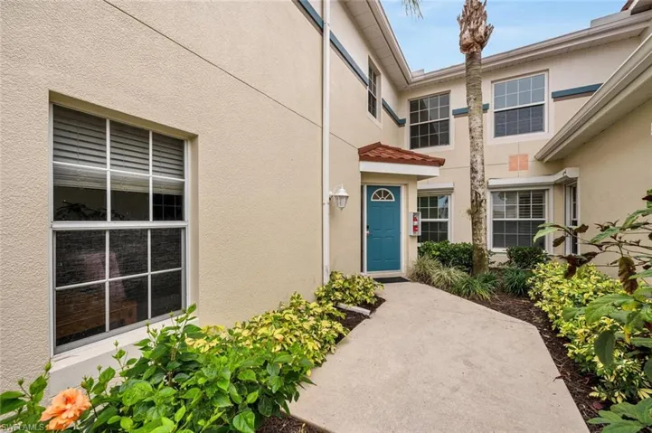 View of exterior entry featuring a patio