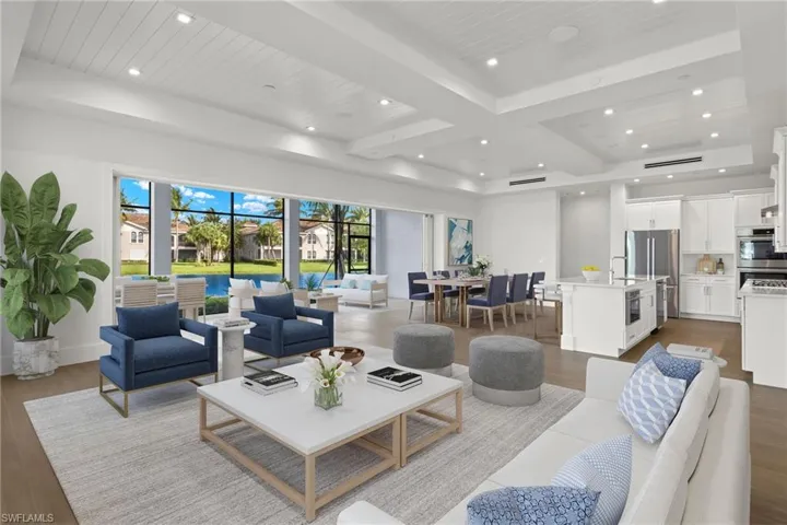 Living room featuring beam ceiling and light hardwood / wood-style floors