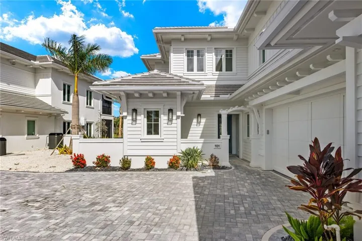 Entrance to property featuring a garage and central AC