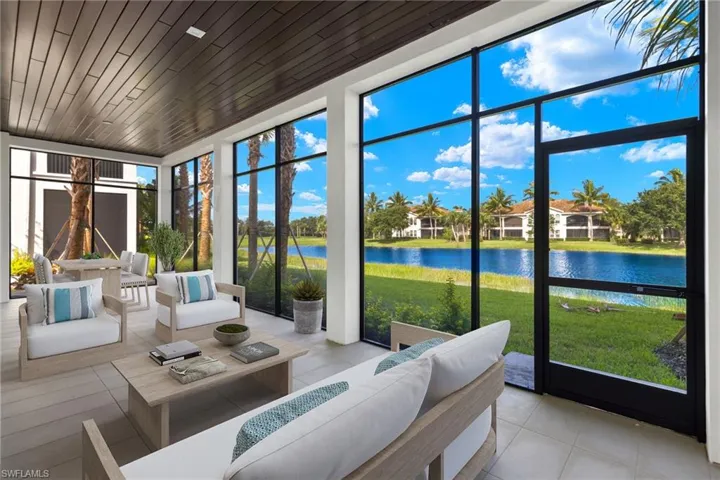 Sun soaked lanai featuring wooden ceiling, plenty of natural light, and a water view....just waiting for that good book and glass of wine
