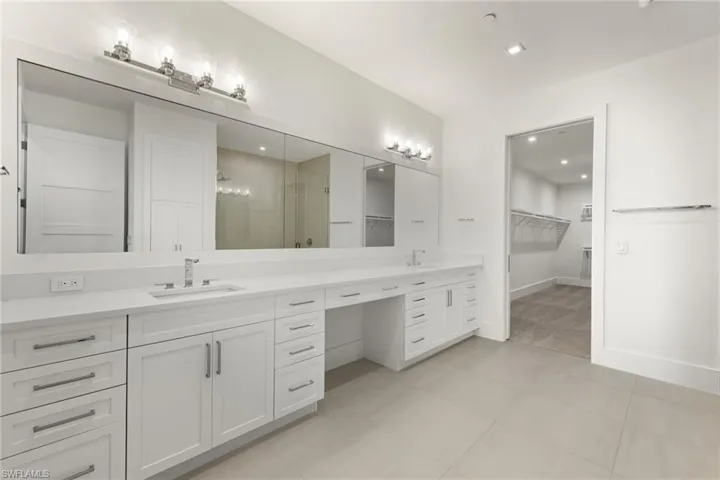 Bathroom with tile floors and double vanity