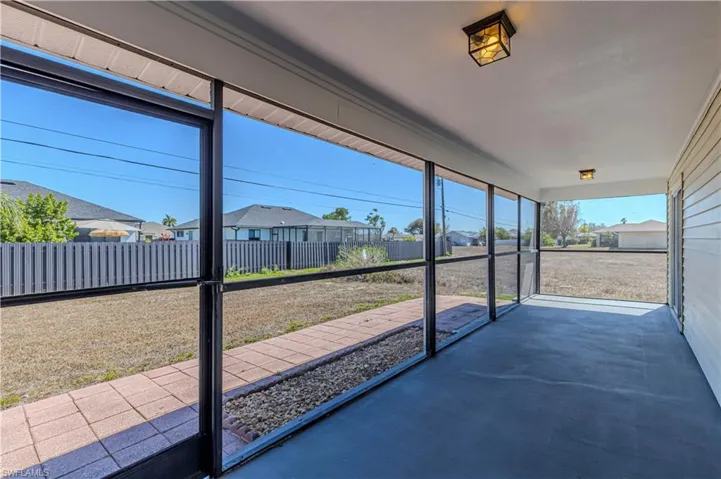 Unfurnished sunroom featuring a residential view