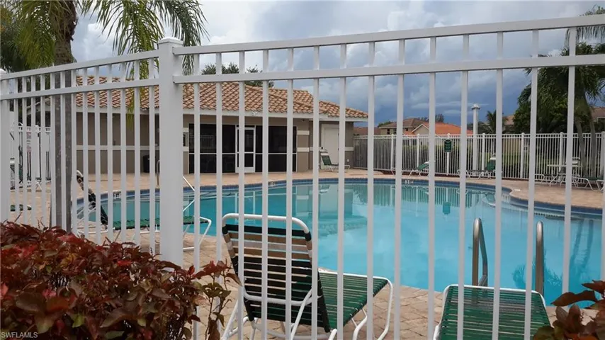 Community pool featuring a patio