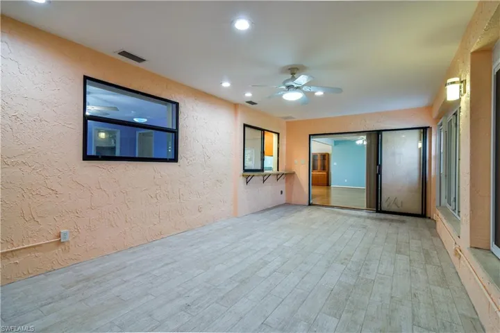 With A/C and Large Windows overlooking Heated, Screened, Swimming Pool