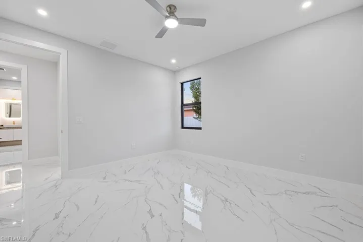 Spare room with ceiling fan
