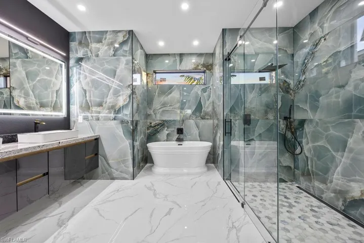 Bathroom with plus walk in shower and vanity