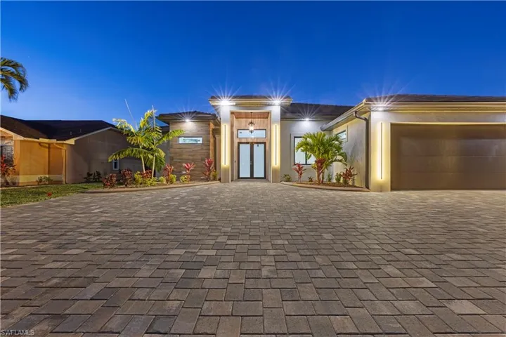 View of front of property featuring a garage