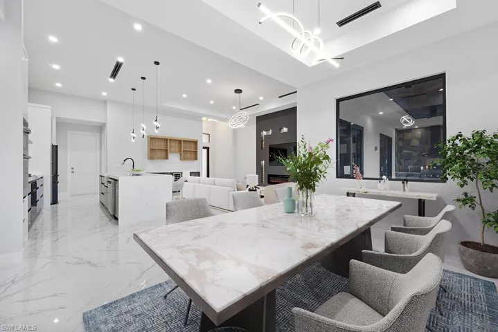 Virtual Stage-Dining space featuring a raised ceiling and sink