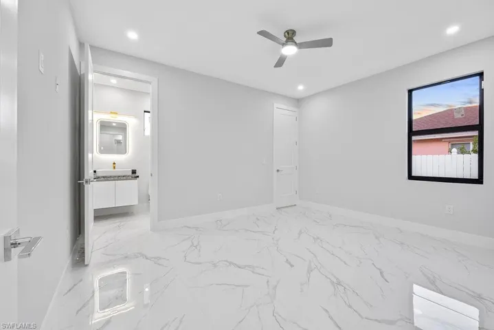 Unfurnished room featuring ceiling fan