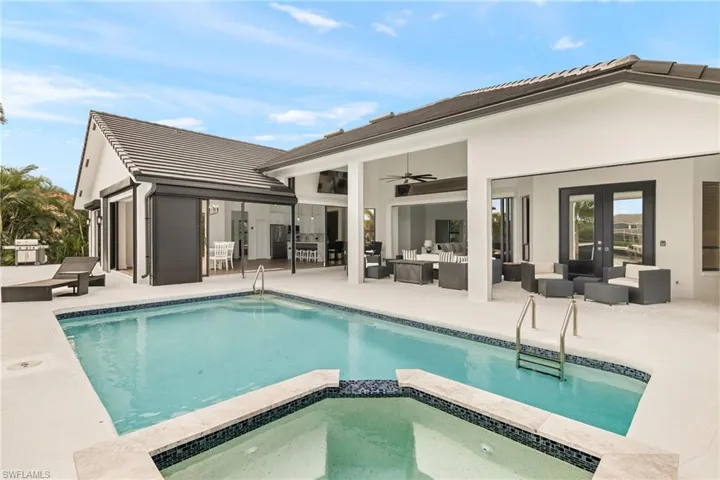 View of swimming pool featuring french doors, a patio area, area for grilling, ceiling fan, and an outdoor hangout area