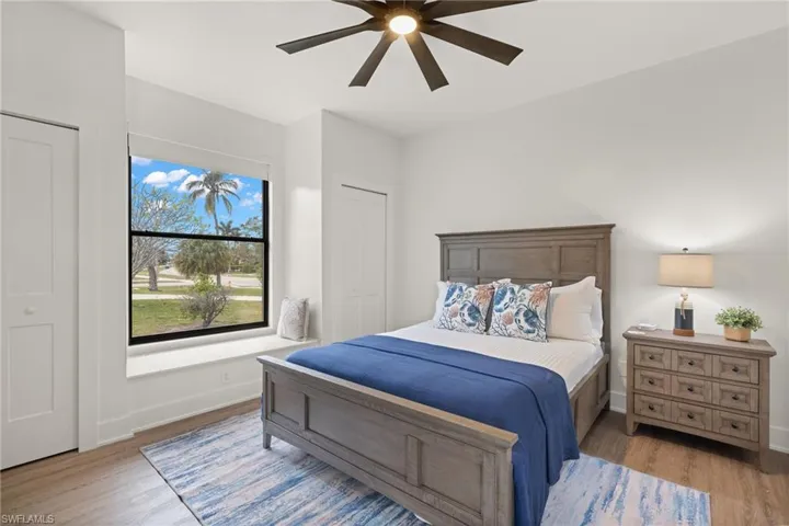 Bedroom featuring ceiling fan and light hardwood / wood-style floors