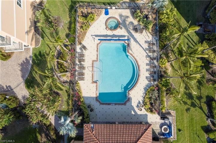 Enjoy mature landscaping and sweeping waterfront views from the heated pool and deck