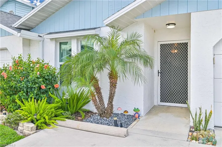 View of exterior entry with stucco siding
