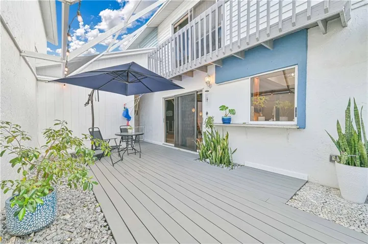 Wooden terrace featuring outdoor dining area
