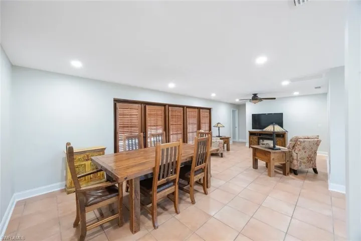 Dining room featuring recessed lighting, baseboards, ceiling fan, and light tile patterned floors